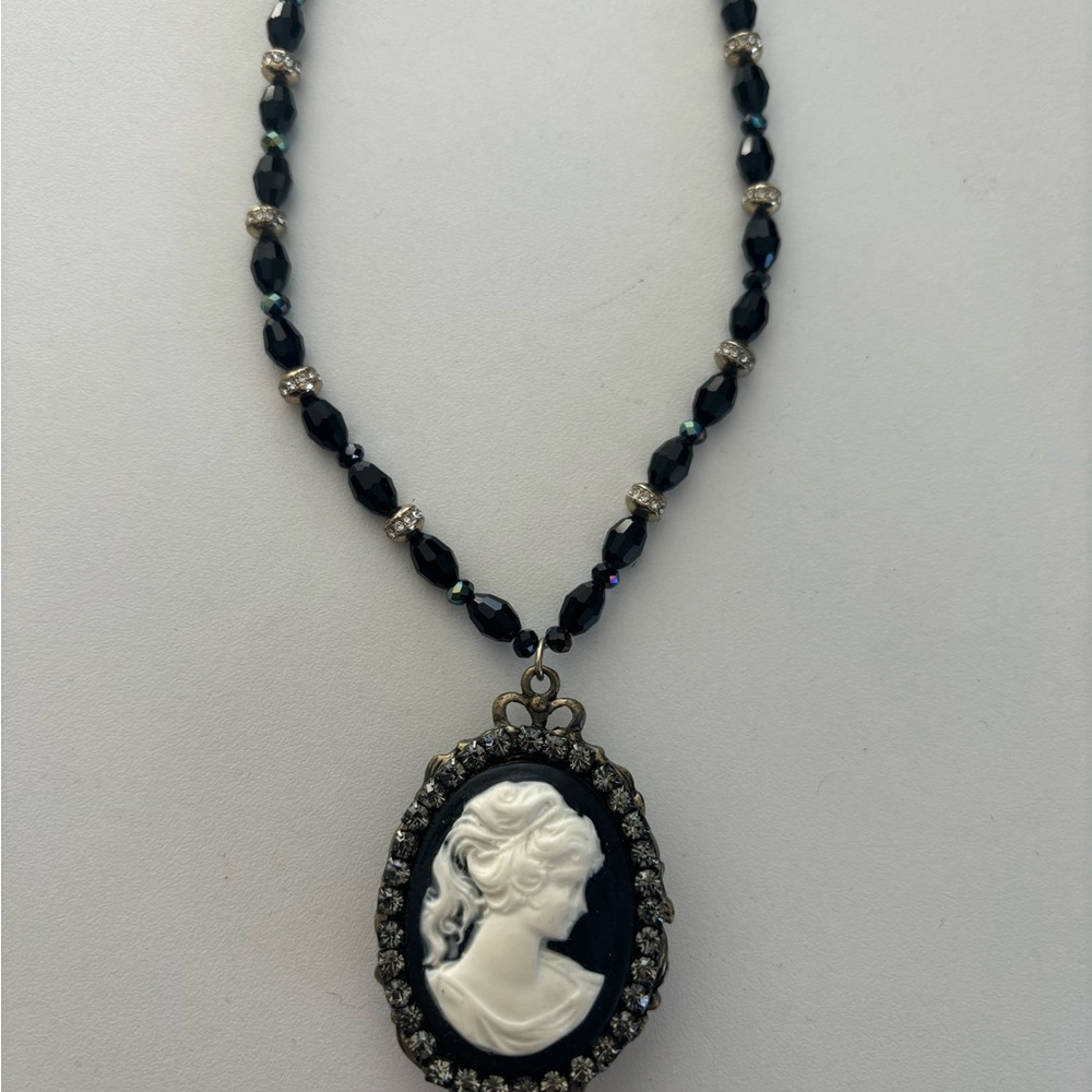 Vintage Cameo necklace in black and white . Adjustable length . Like new !